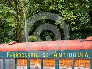 MEDELLIN, COLOMBIA - Dec 03, 2020: Old Train Car Reused with the Name of Ã¢â¬ÅRailroad of AntioquiaÃ¢â¬Å in a Forest